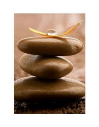 Pile of brown massage stones on wooden background - reprodukcja