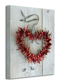Obraz na płótnie przedstawia serce z papryczek chilli