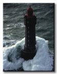 Obraz ścienny na płótnie przedstawiający latarnię morską podczas sztormu