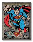 Obraz 60x80 przedstawia lecącego Supermana na kreskówkowym tle