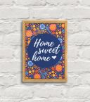 oprawiony w drewnianą, naturalną ramkę plakat pod tytułem ''Homme sweet home''