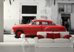 aranżacja fototapety z czerwonym Cadillaciem w białym pokoju nad sofą z czerwonymi poduszkami