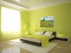 aranżacja fototapety z wiejskim krajobrazem w zielonej przestronnej sypialni
