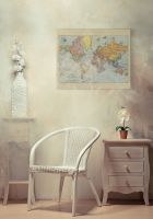 Canvas wiszący w pokoju nad białym krzesłem przedstawiający Mapę Świata 1920