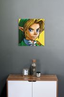 Canvas The Legend Of Zelda Link zawieszony na szarej ścianie w pokoju nad szafką