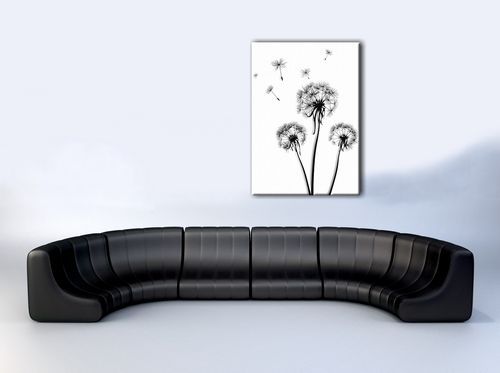 aranżacja obrazu z dmuchawcami w białym pokoju nad czarną sofą