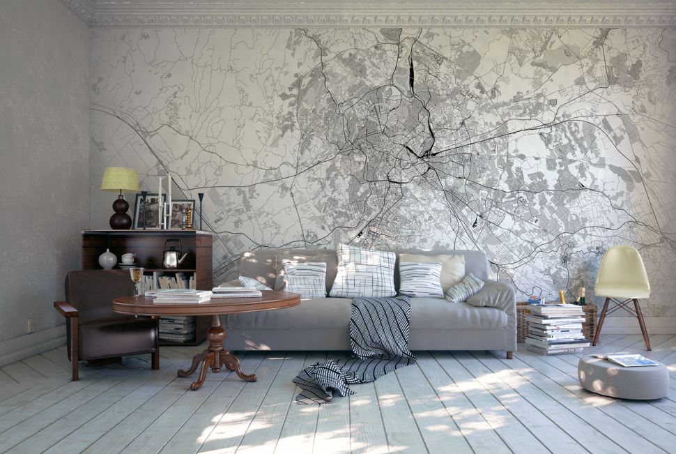 Nowocześnie urządzony salon w którym wisi na ścianie fototapeta z mapą Rzymu