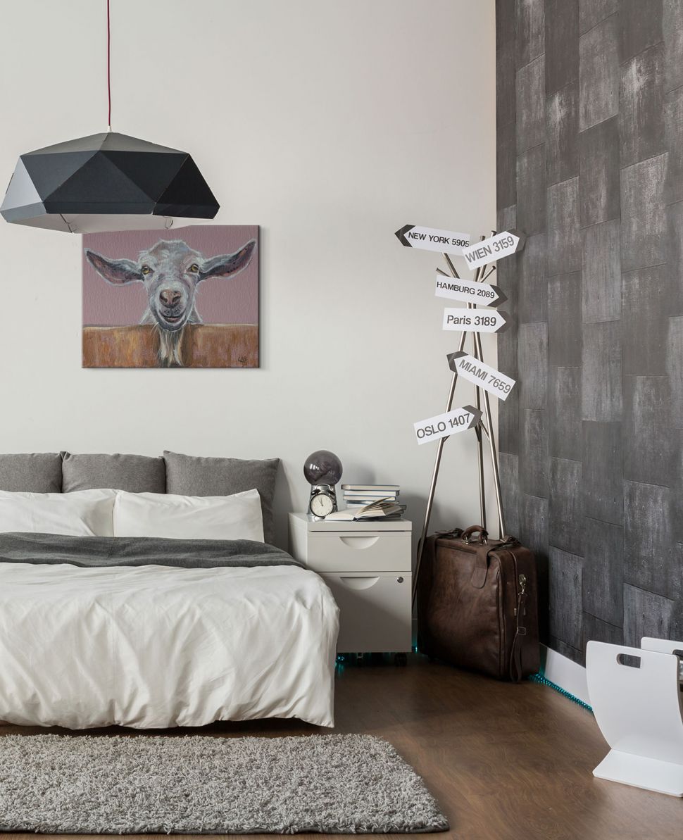 Obraz na płótnie wiszący w sypialni nad łóżkiem przedstawiający kozę