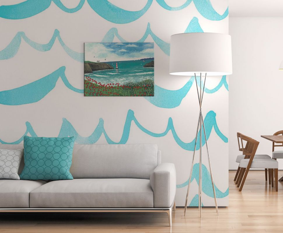 Obraz na płótnie przedstawiający wybrzeże Poppy Bay wiszący w salonie nad białą kanapą