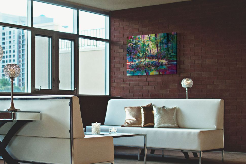 Obraz na płótnie Brick Yard Pond wiszący w salonie nad białą kanapą na ścianie z cegły