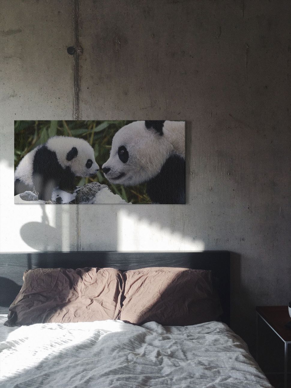 Obraz na płótnie przedstawiający dwie pandy powieszony w sypialni nad łóżkiem