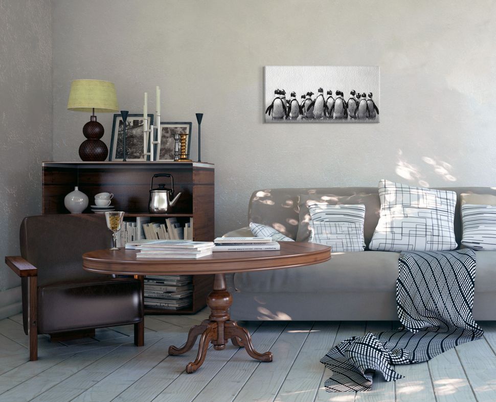 Canvas Pingwinie stado malarki Mariny Cano zawieszony w przestronnym salonie nad szarą kanapą